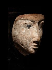 An Egyptian Wood Mummy Mask of a Woman