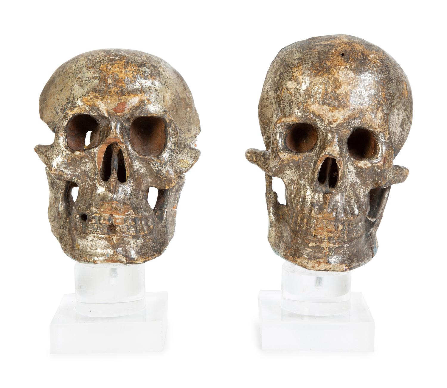 Two Italian Silvered Wood Memento Mori Skulls — 17TH CENTURY