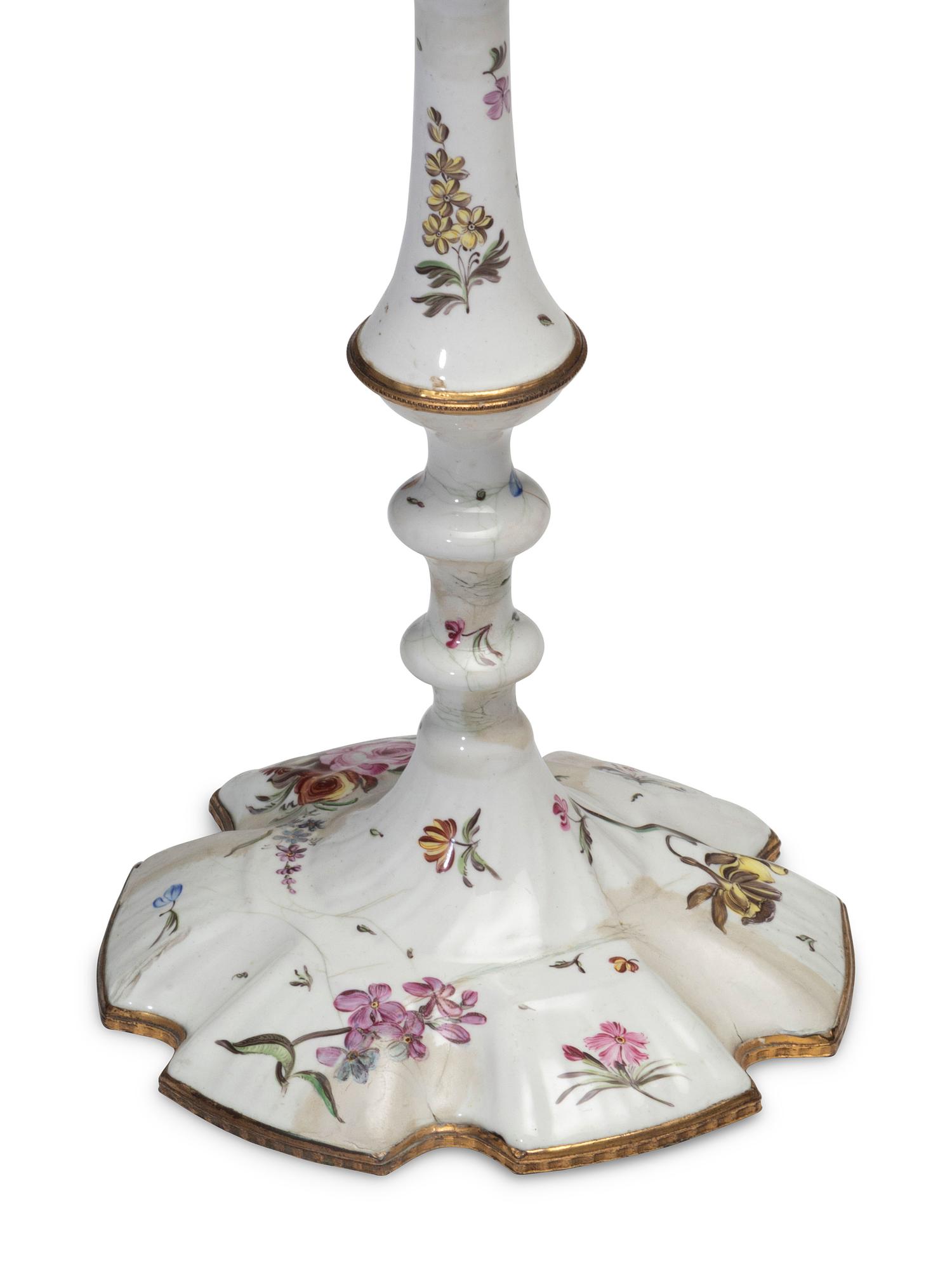 A Pair of Battersea Enamel Candlesticks