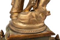 A Neoclassical Gilt Metal and Onyx Clock Garniture