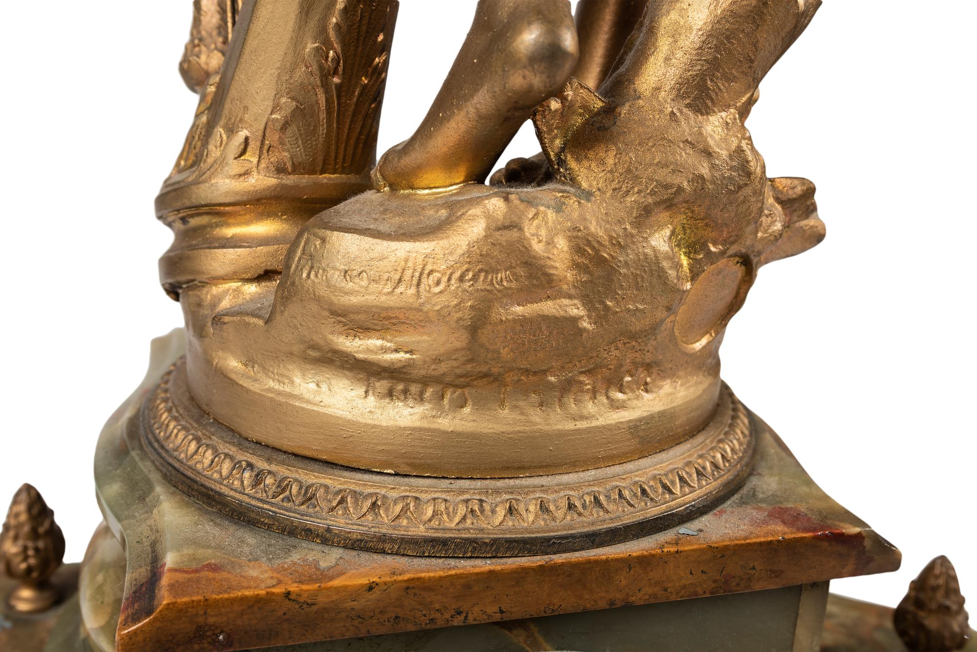 A Neoclassical Gilt Metal and Onyx Clock Garniture