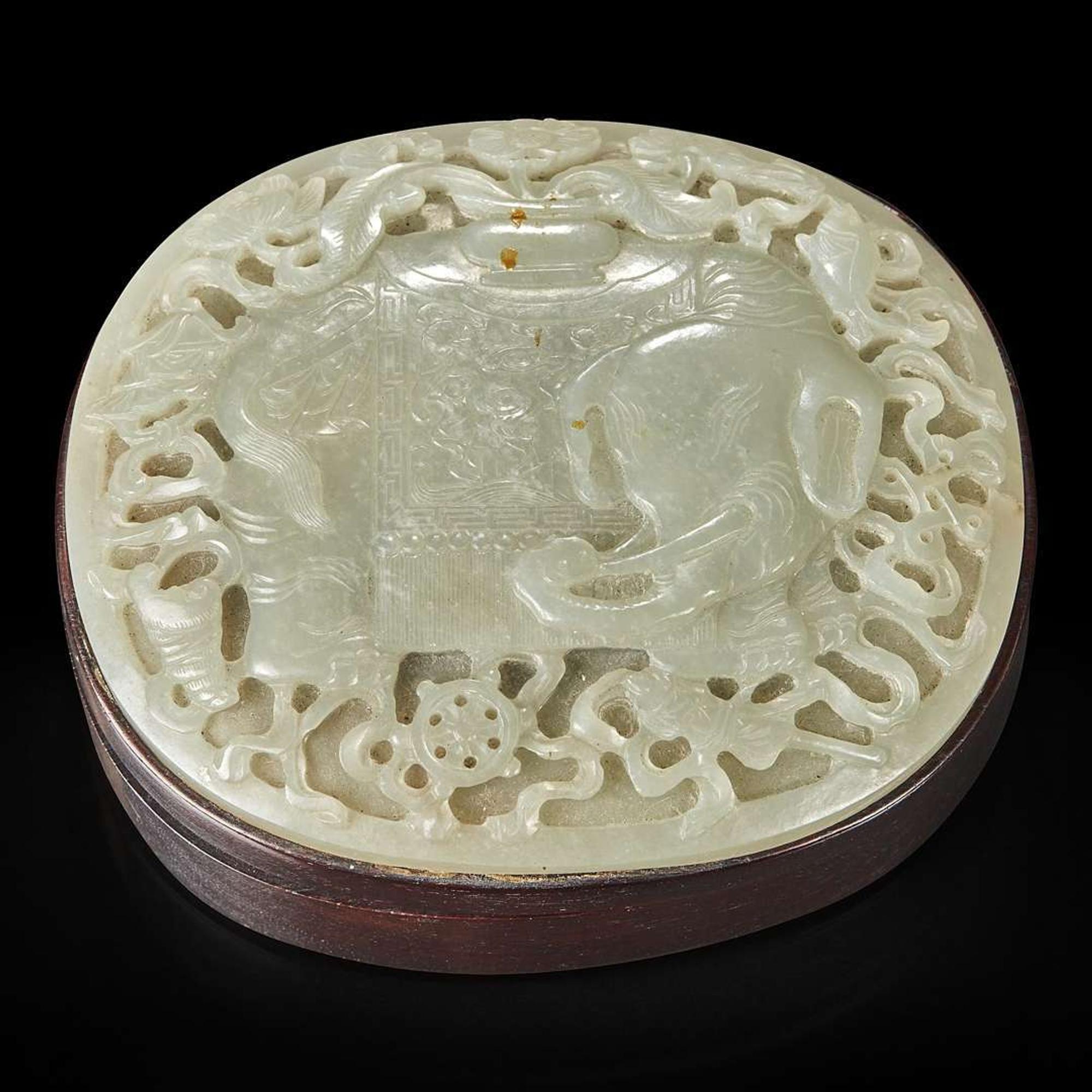 A Chinese carved celadon jade "Elephant" plaque mounted as a box 木盒嵌太平有象浮雕玉板
