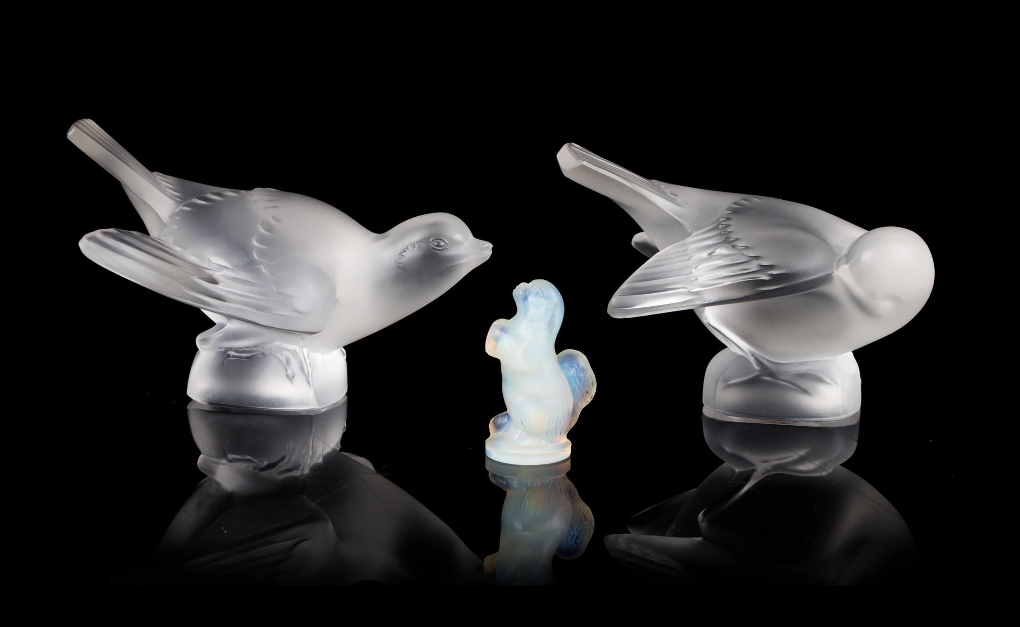 Lalique, two molded and frosted glass figures, depicting birds, together with a Sabino glass dog