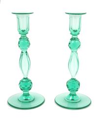 Style of Steuben, (American, 20th Century), pair of green candlesticks