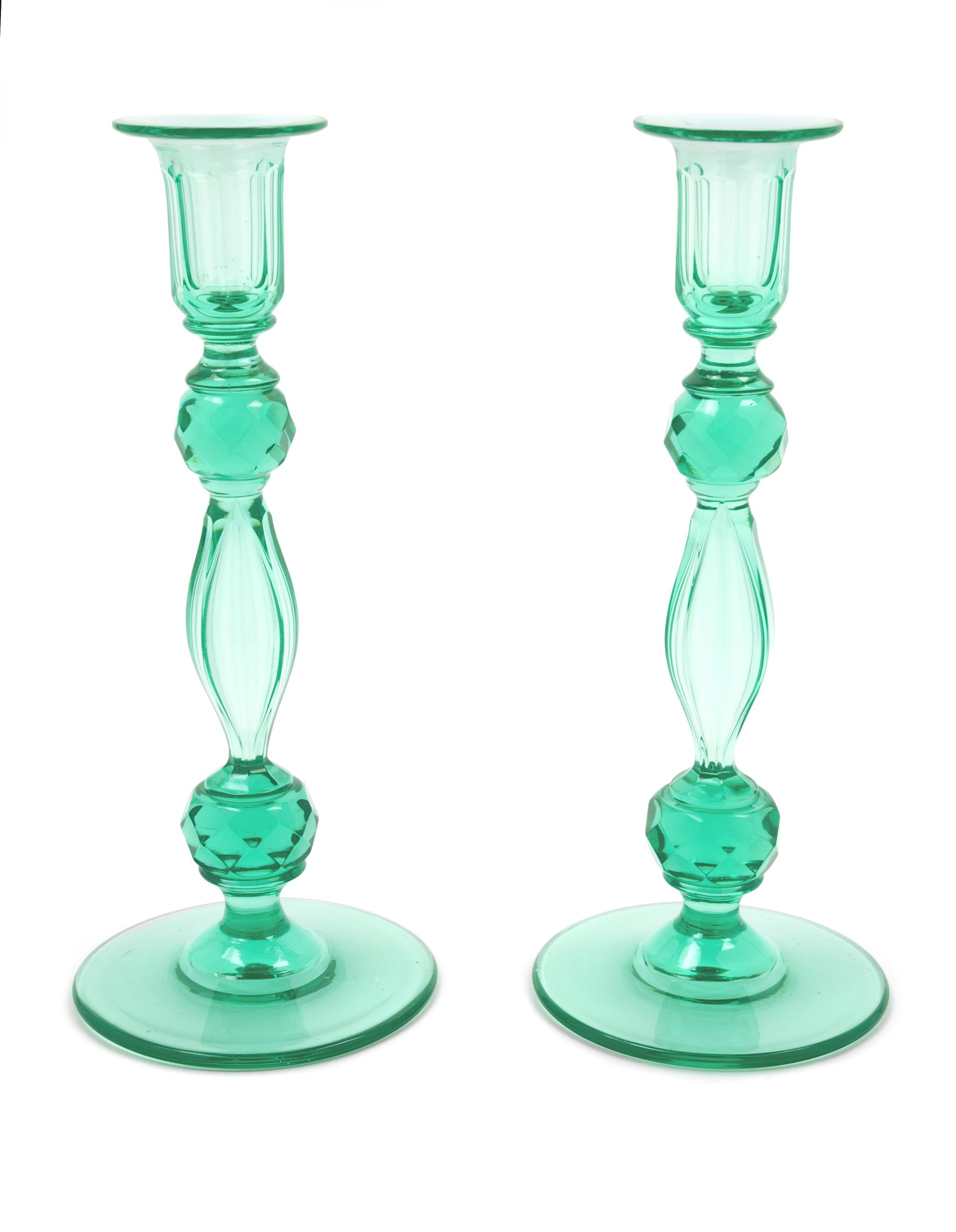 Style of Steuben, (American, 20th Century), pair of green candlesticks