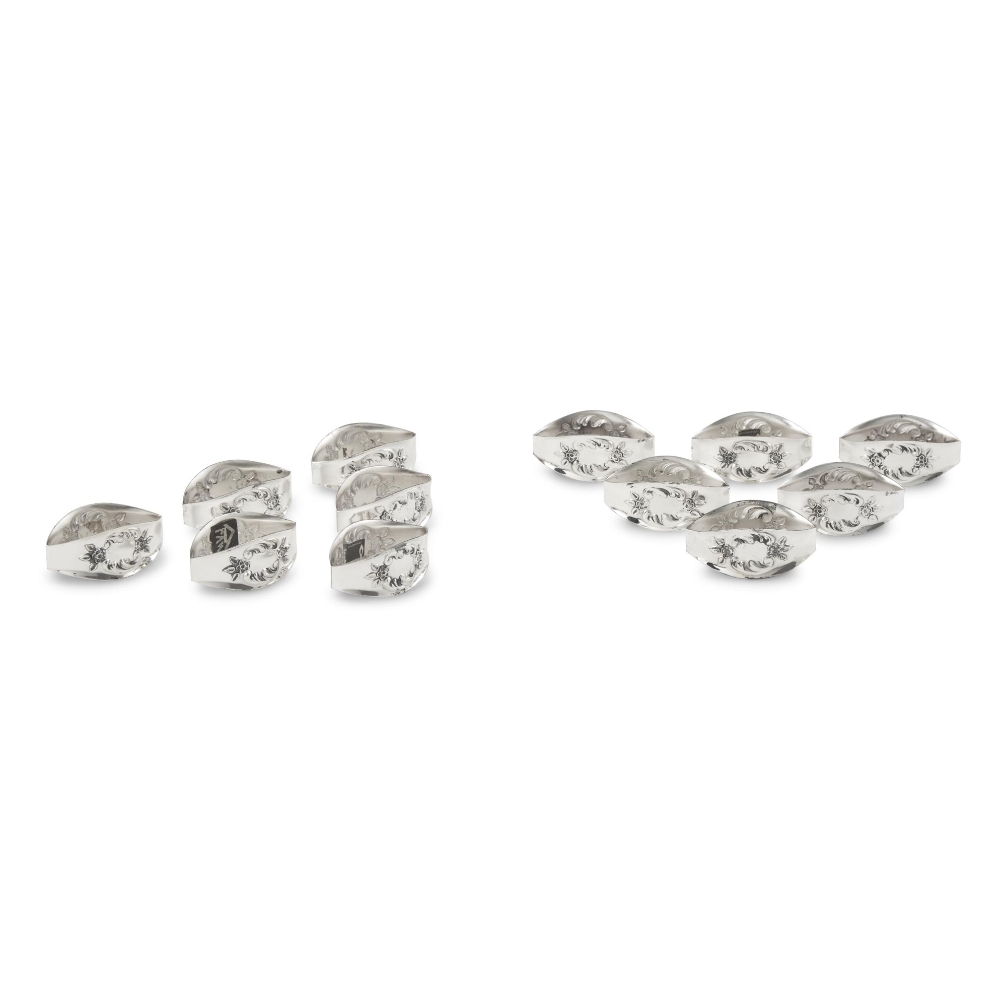 A Set of Twelve German Silver Napkin Rings