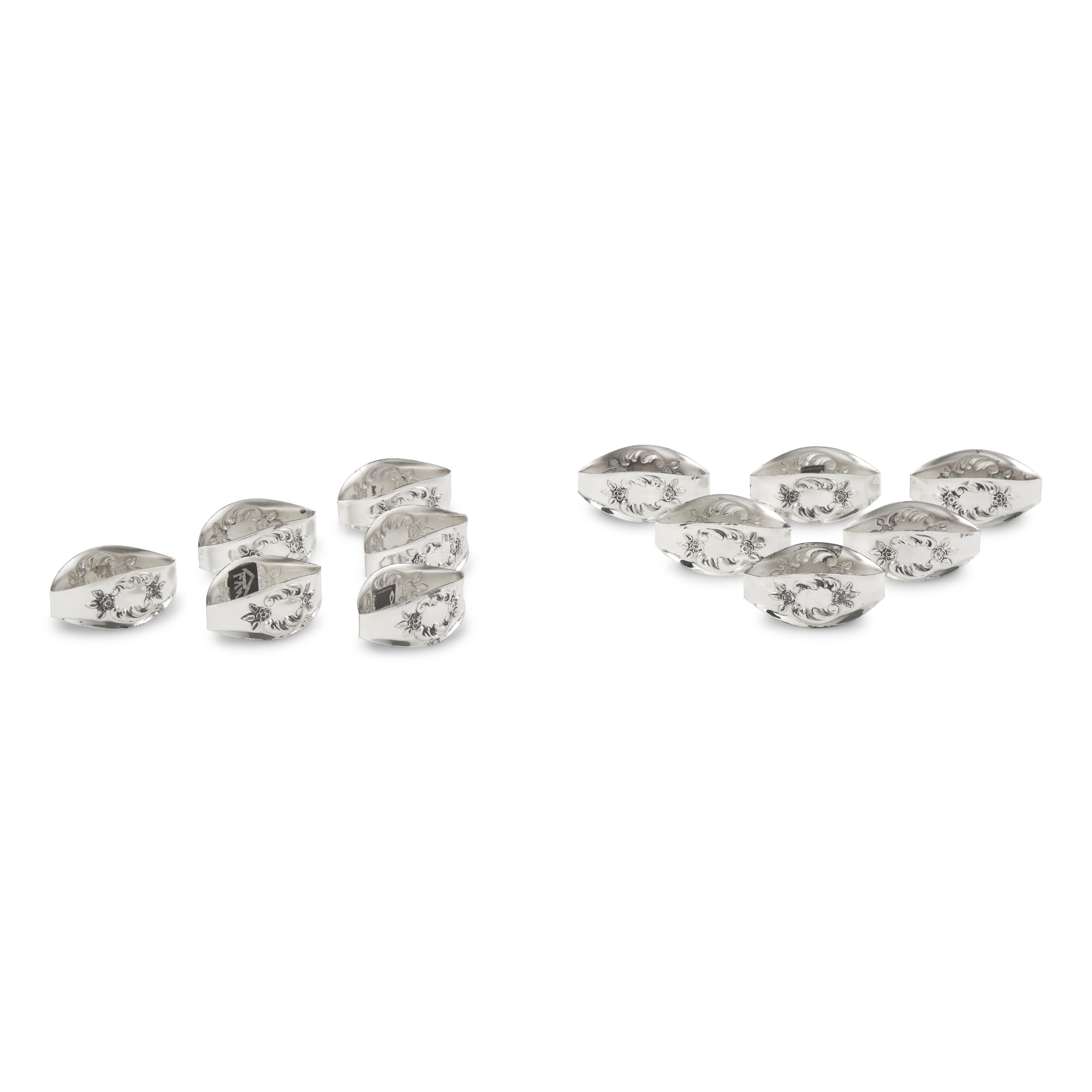 A Set of Twelve German Silver Napkin Rings