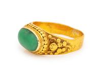 A High Karat Yellow Gold and Jade Ring,