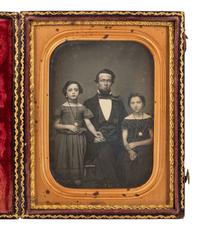 [EARLY PHOT.]. 2 daguerreotypes of attractive subjects, incl. father with children & young woman.