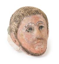 A Romano-Egyptian Plaster Mummy Mask Height 9 1/2 inches. — CIRCA 2ND CENTURY C.E.