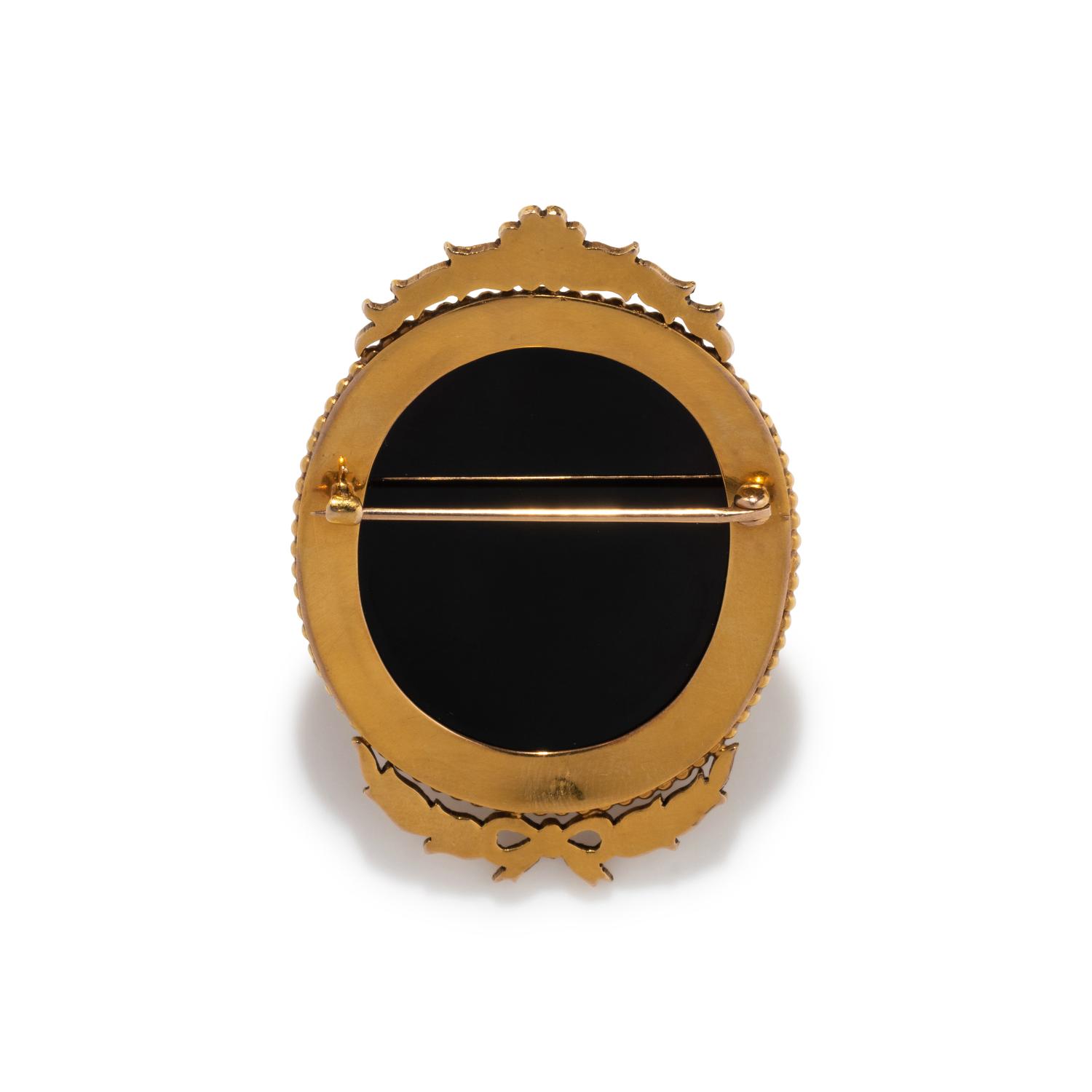 A Neoclassical Gold and Onyx Cameo Brooch with the Head of Medusa