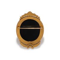 A Neoclassical Gold and Onyx Cameo Brooch with the Head of Medusa