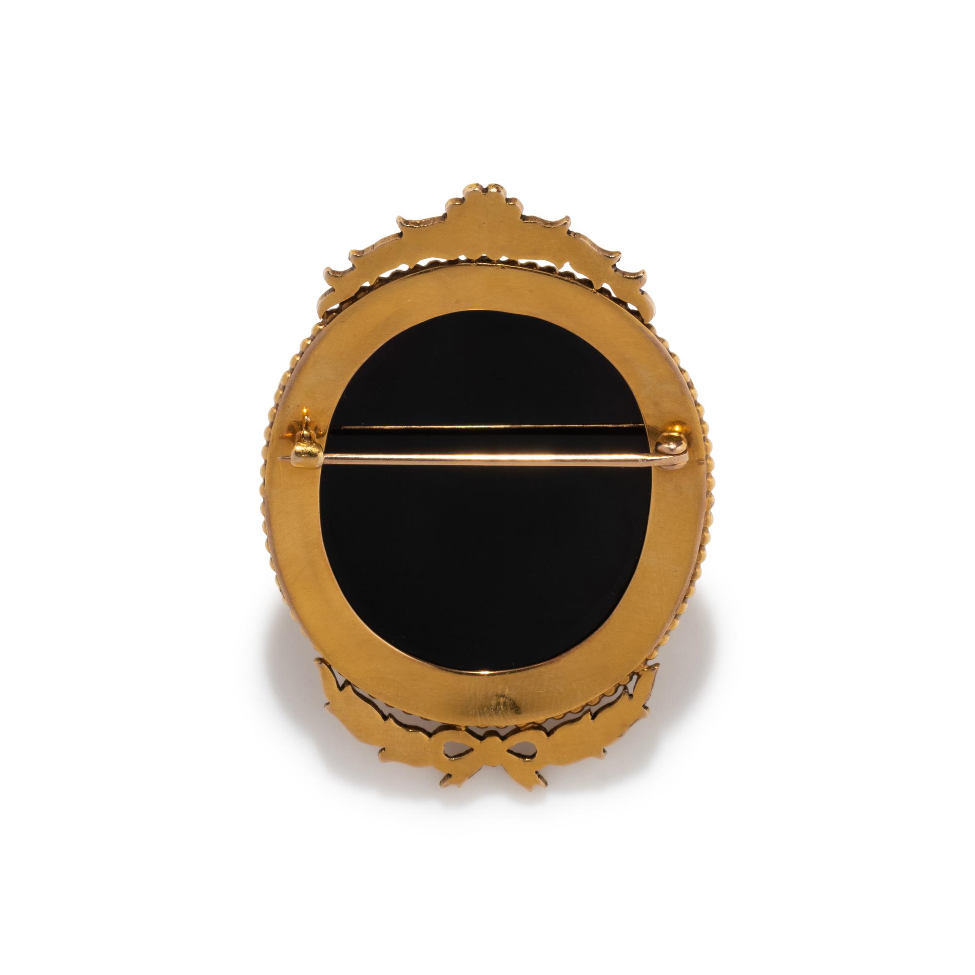 A Neoclassical Gold and Onyx Cameo Brooch with the Head of Medusa