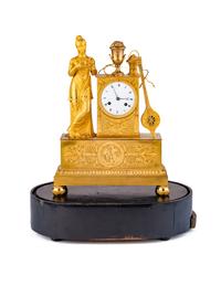 An Empire Gilt Bronze Musical Clock