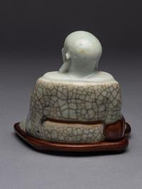 A Qingbai Glazed Porcelain Figure of Budhai Buddha
