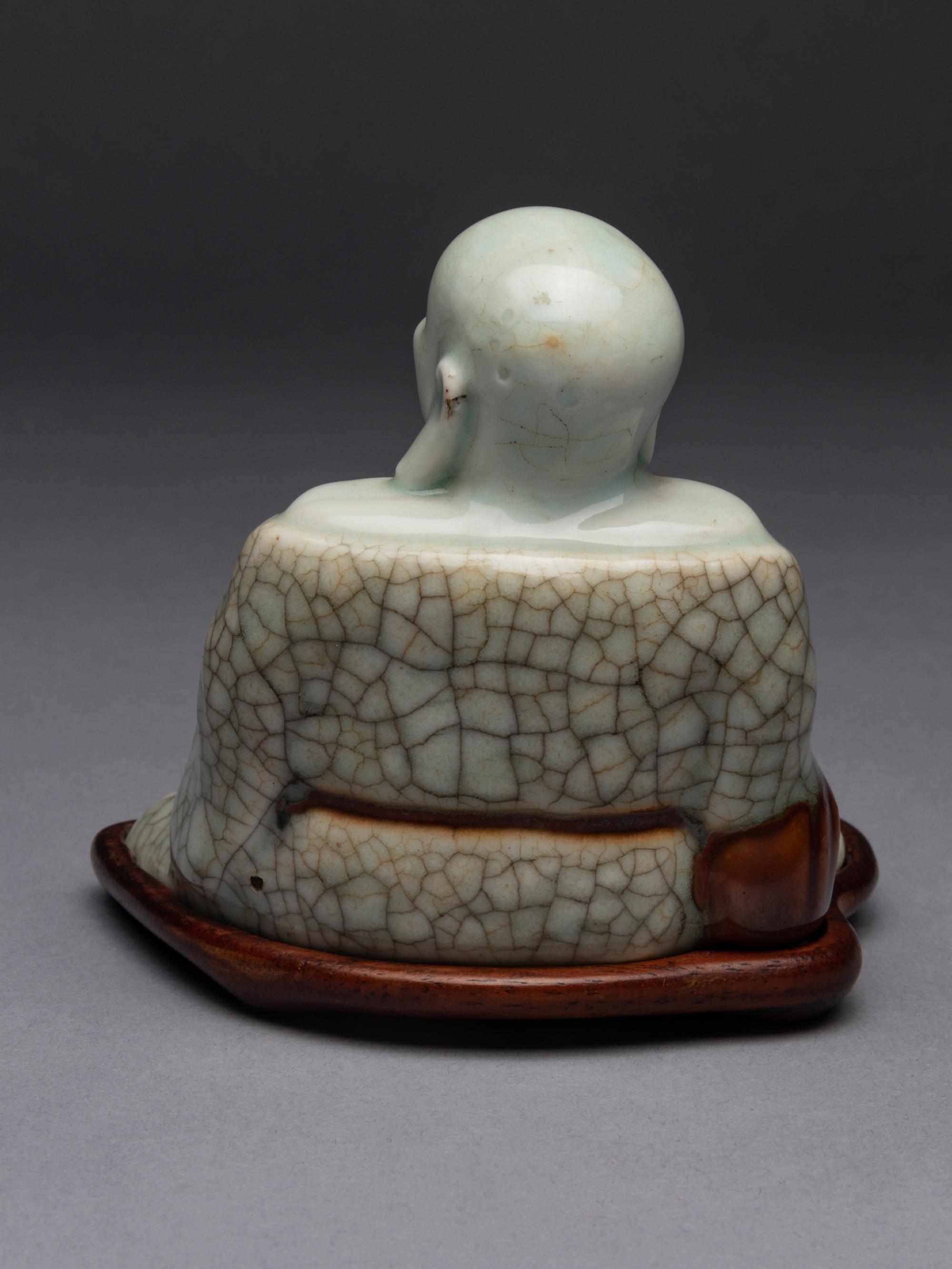 A Qingbai Glazed Porcelain Figure of Budhai Buddha