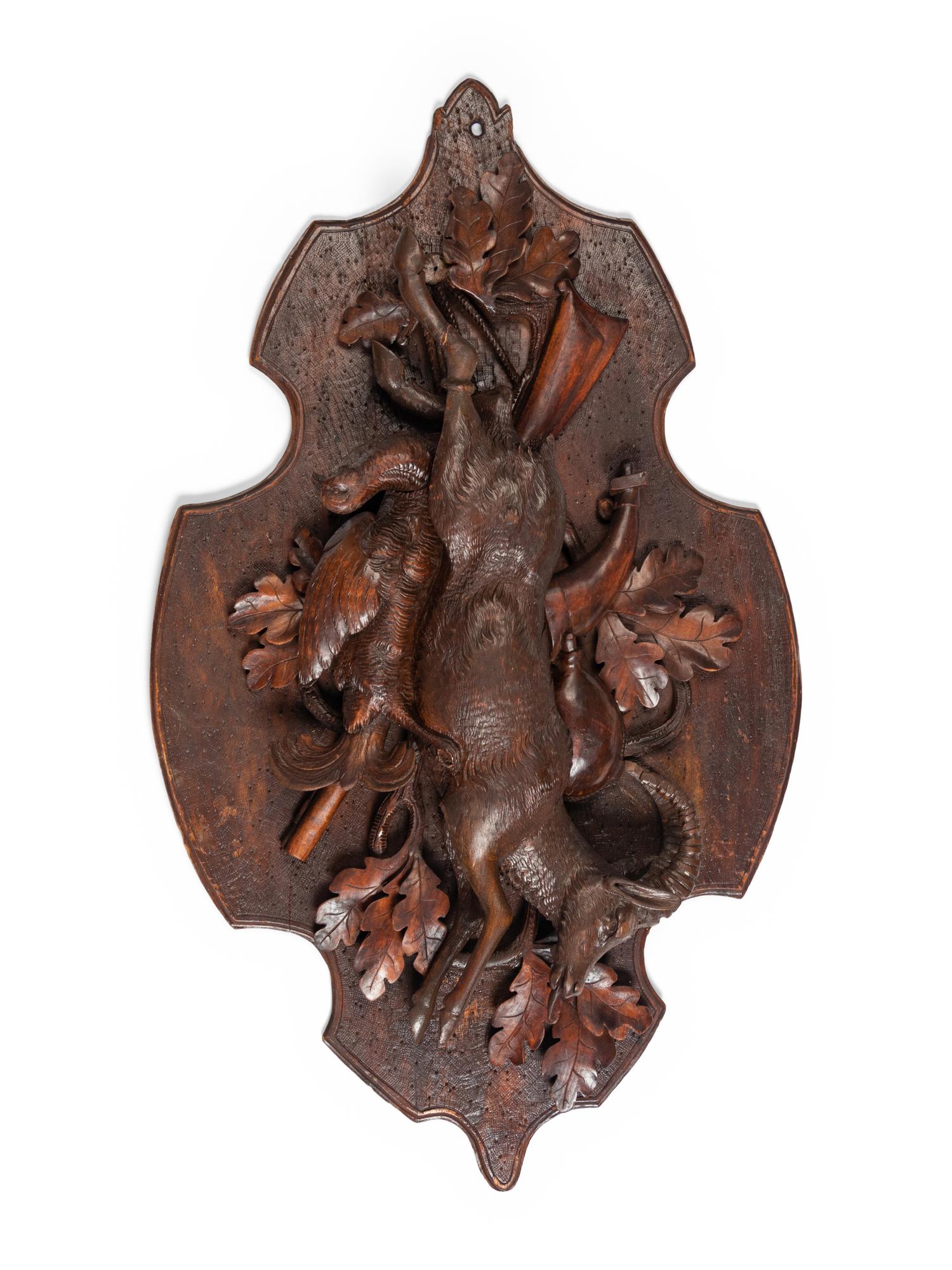 A Pair of Large Black Forest Carved Walnut Game Plaques