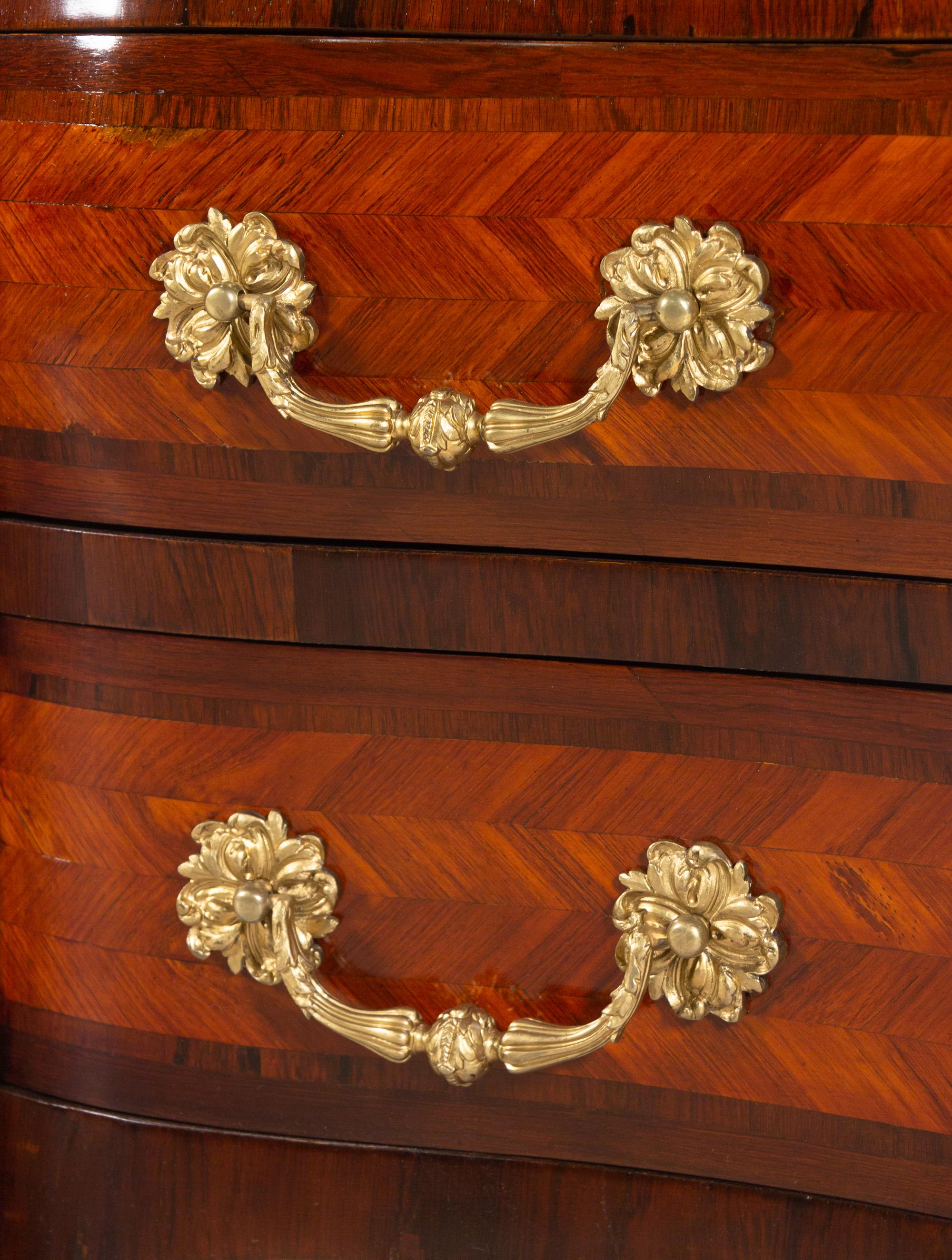 A Régence Style Gilt Bronze Mounted Parquetry Marble-Top Bombe Commode