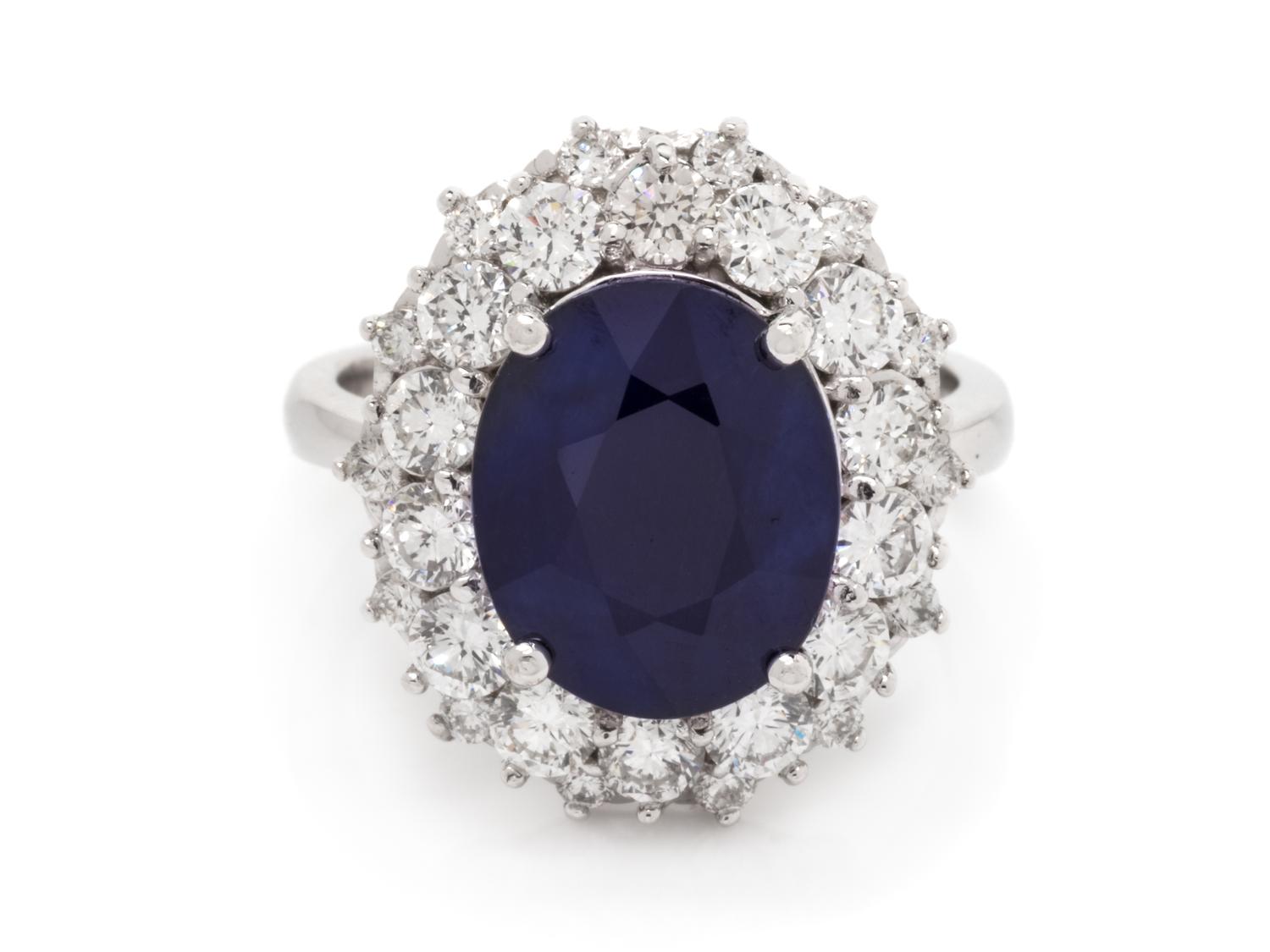 A 14 Karat White Gold, Sapphire and Diamond Ring,