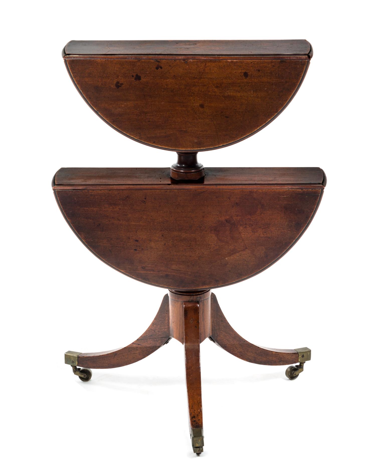 A Regency Style Mahogany Two-Tiered Drop-Leaf Dumb Waiter, Height 31 3/4 inches.