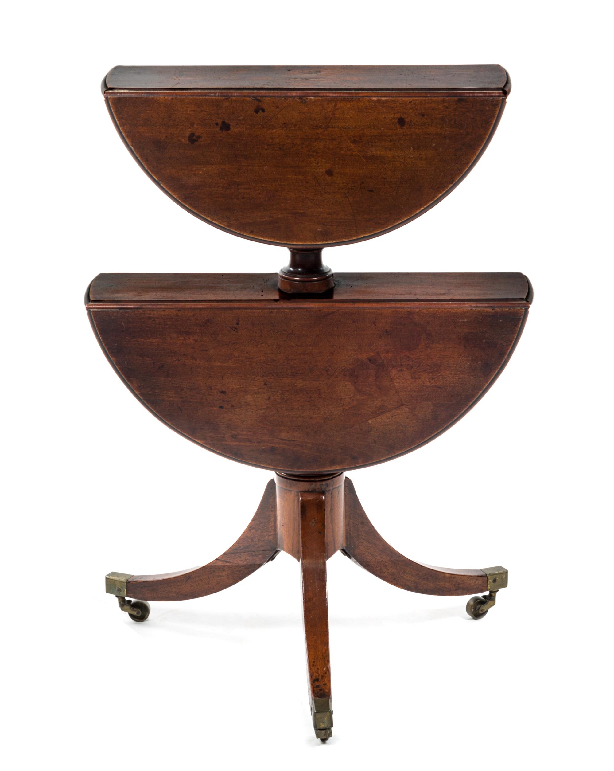 A Regency Style Mahogany Two-Tiered Drop-Leaf Dumb Waiter, Height 31 3/4 inches.
