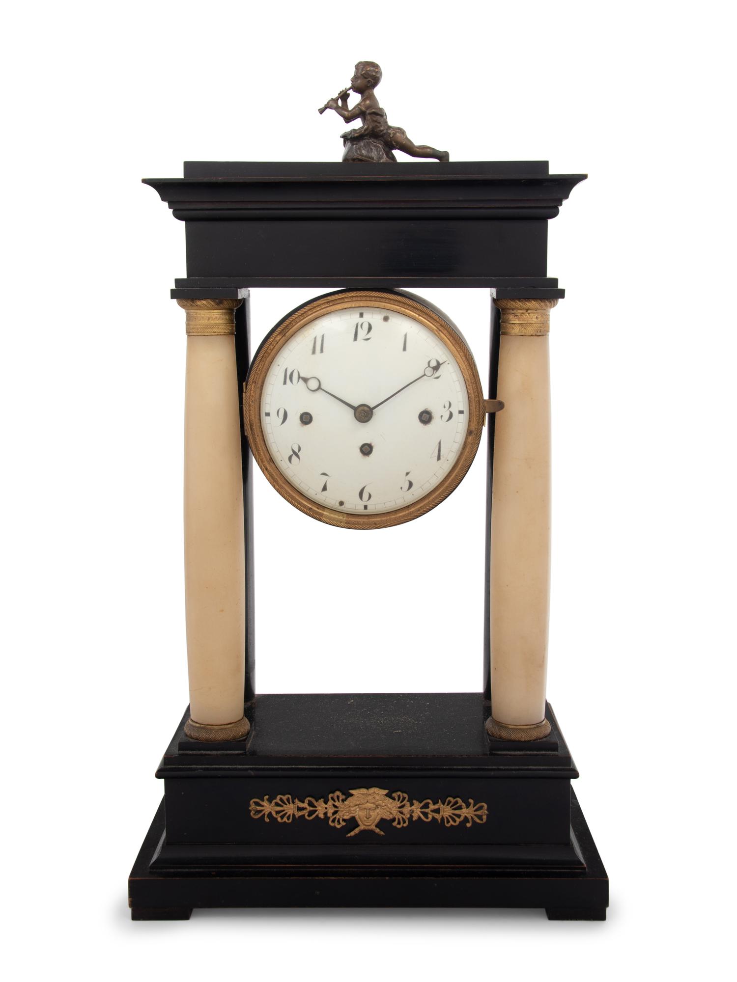 An Empire Style Gilt Metal and Alabaster Mounted Ebonized Clock