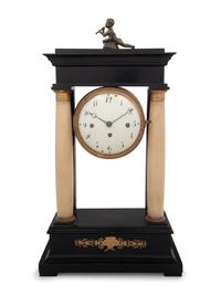 An Empire Style Gilt Metal and Alabaster Mounted Ebonized Clock