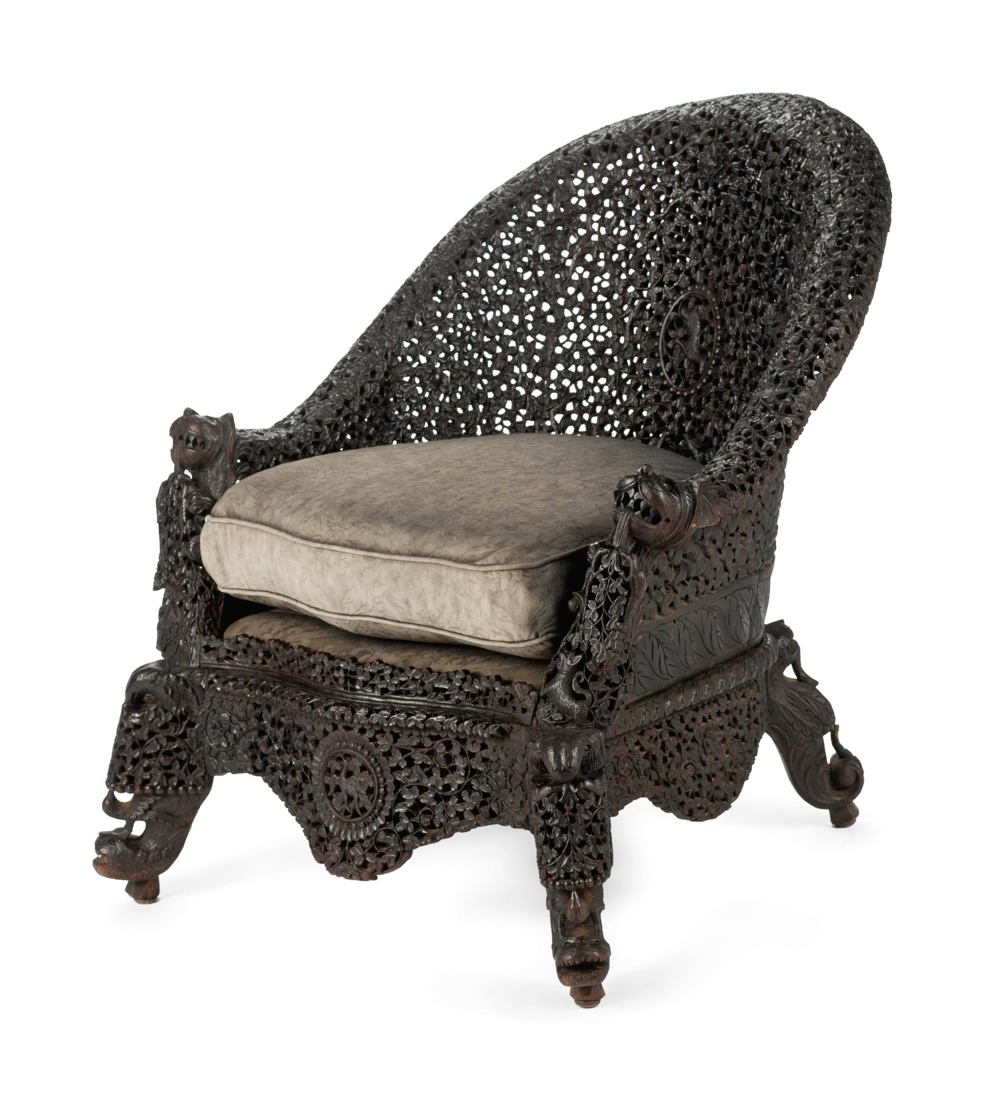 An Anglo-Indian Carved Hardwood Armchair