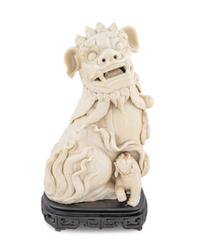A Chinese Blanc de Chine Porcelain Fu-Lion — 20TH CENTURY