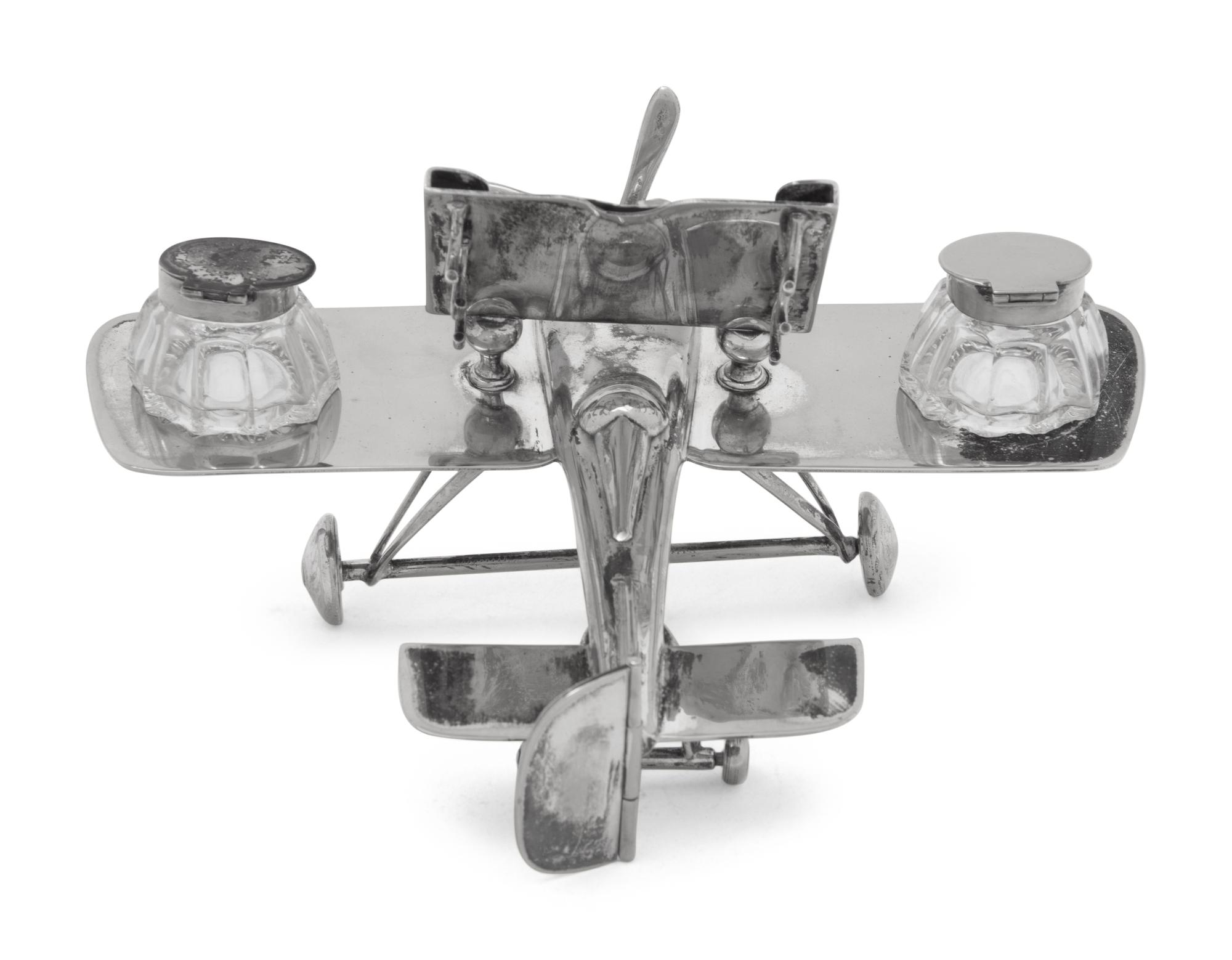 A Silver-Plate Airplane Form Ink-Well and Desk Calendar