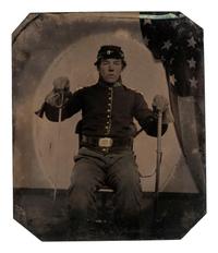 [CIVIL WAR]. Sixth plate tintype of an armed Union cavalryman uniquely displaying his saber and scabbard.
