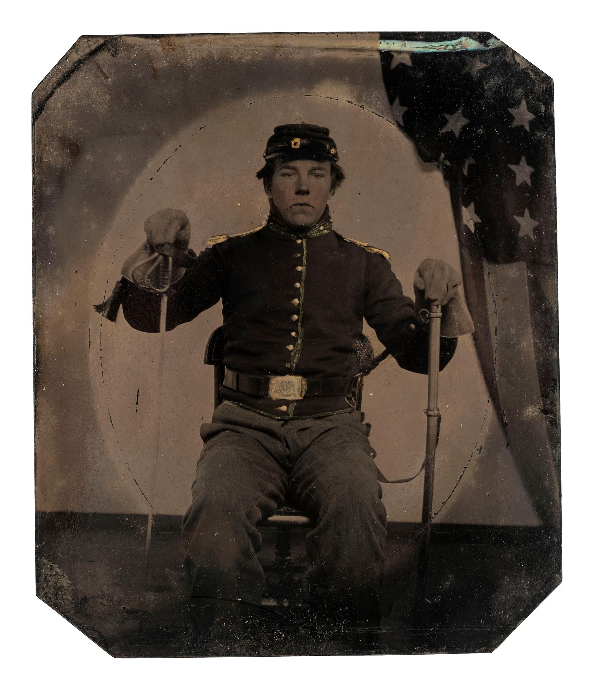[CIVIL WAR]. Sixth plate tintype of an armed Union cavalryman uniquely displaying his saber and scabbard.