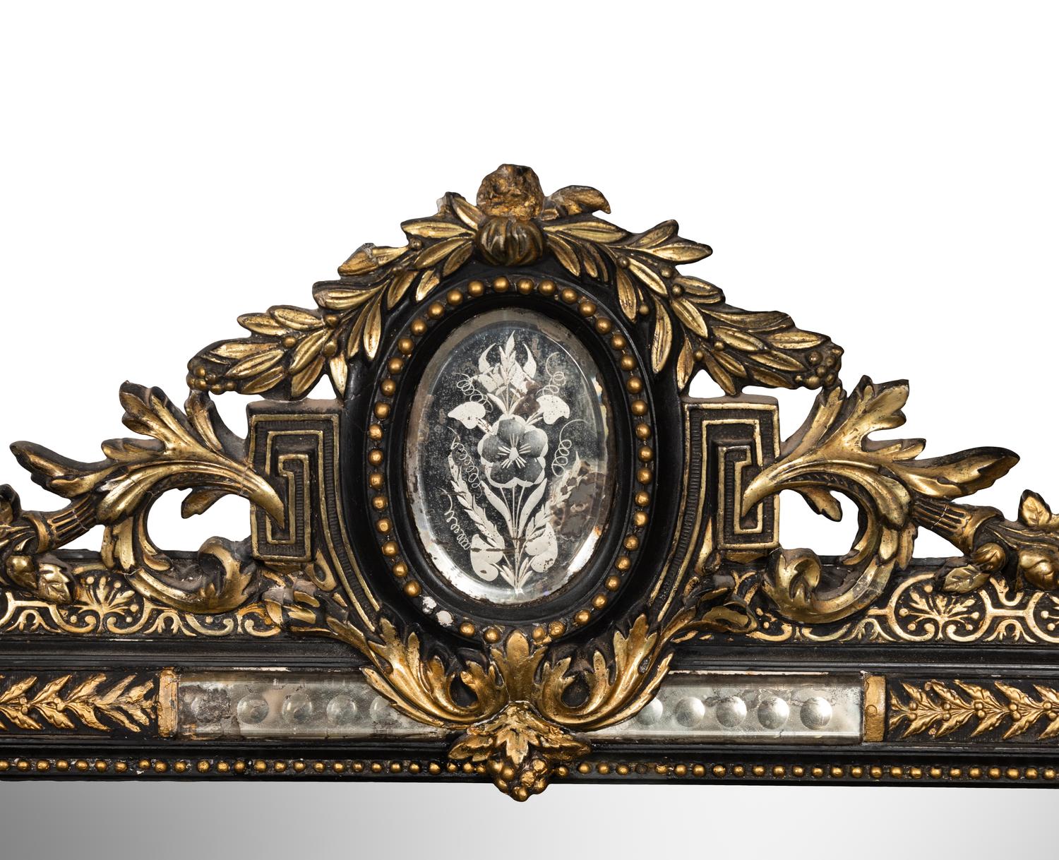 A Victorian Ebonized and Parcel-Gilt Mirror