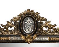 A Victorian Ebonized and Parcel-Gilt Mirror