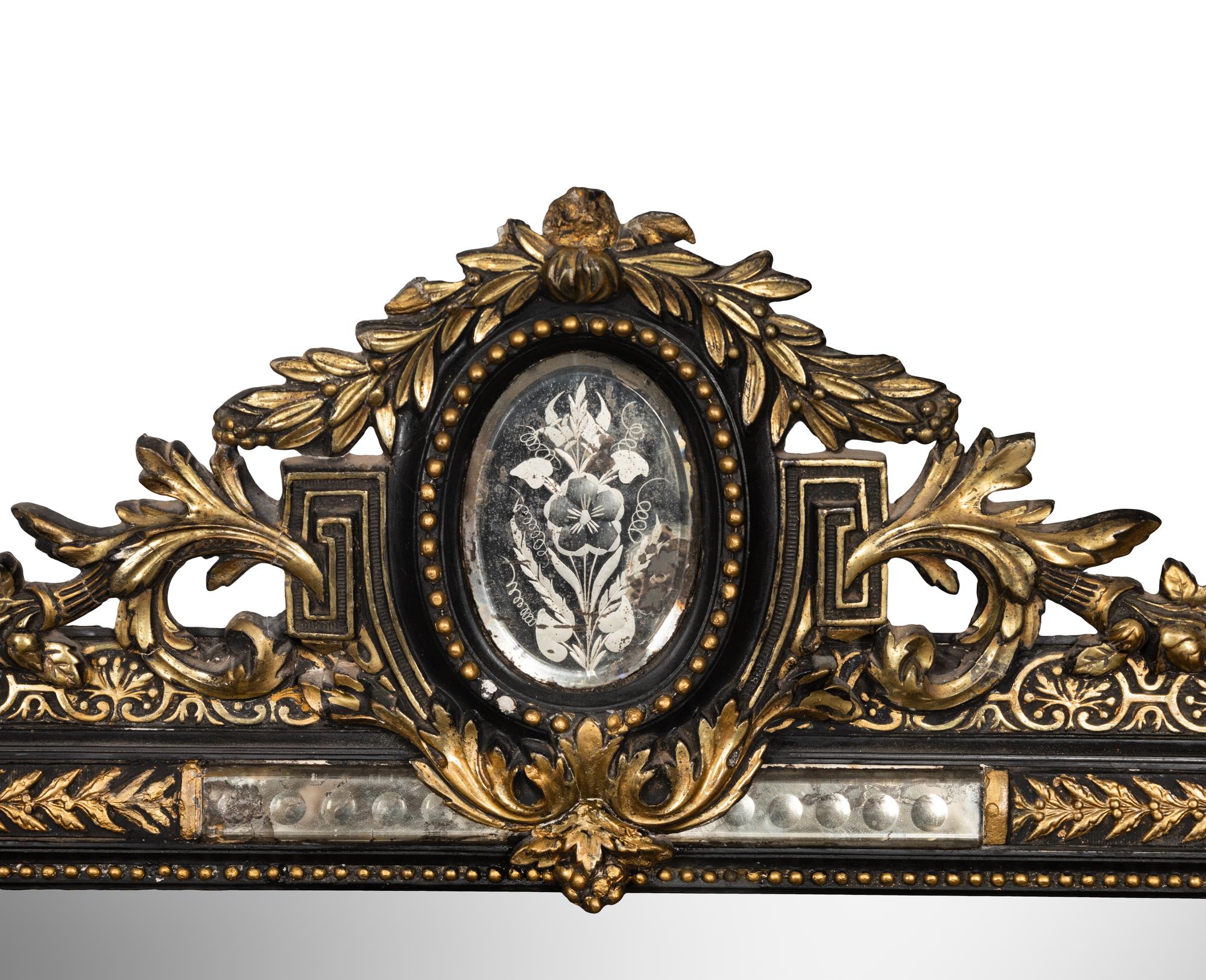 A Victorian Ebonized and Parcel-Gilt Mirror