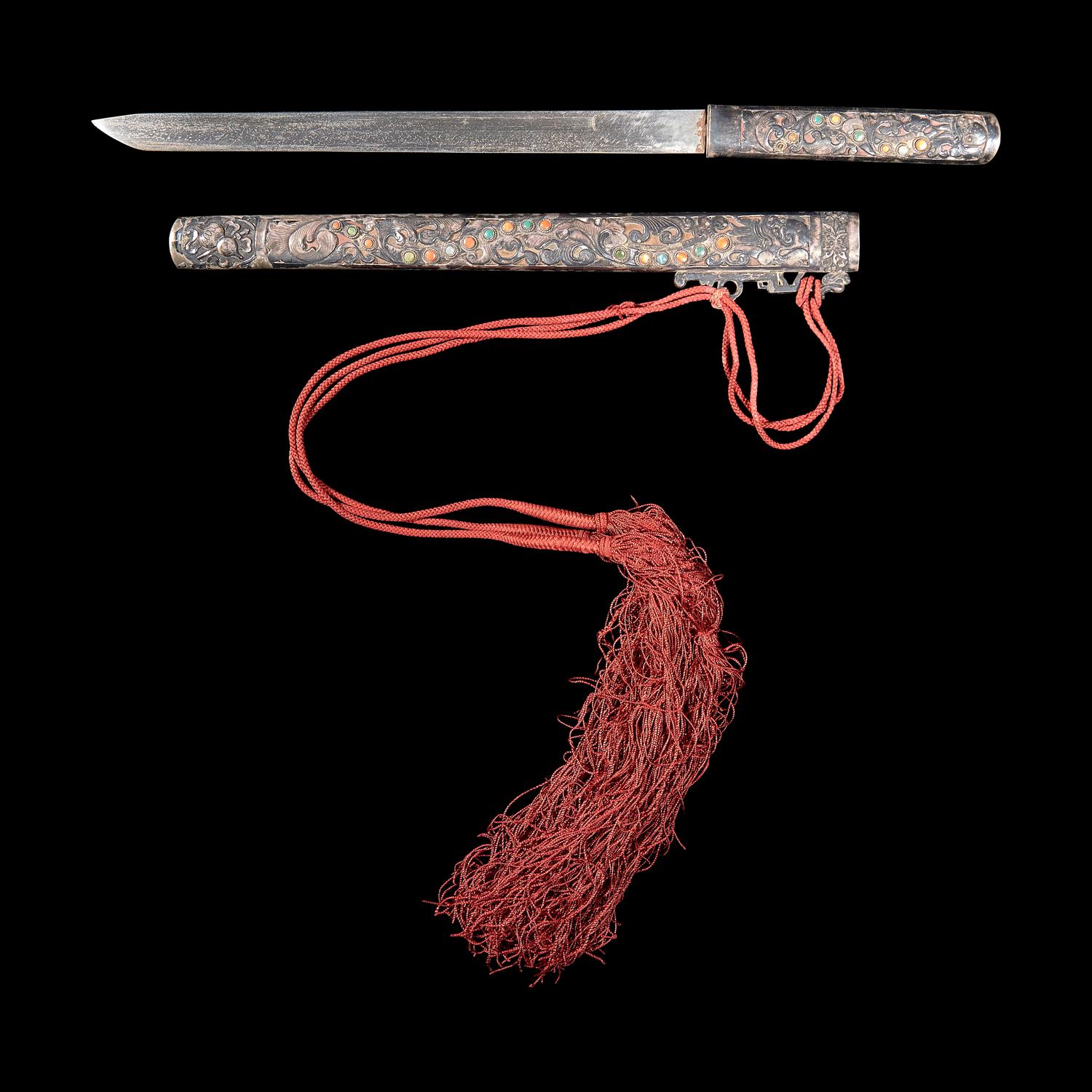 A Sino-Tibetan or Mongolian Embellished Silver Knife and Scabbard 藏漢或蒙古 嵌寶銀匕首一幅
