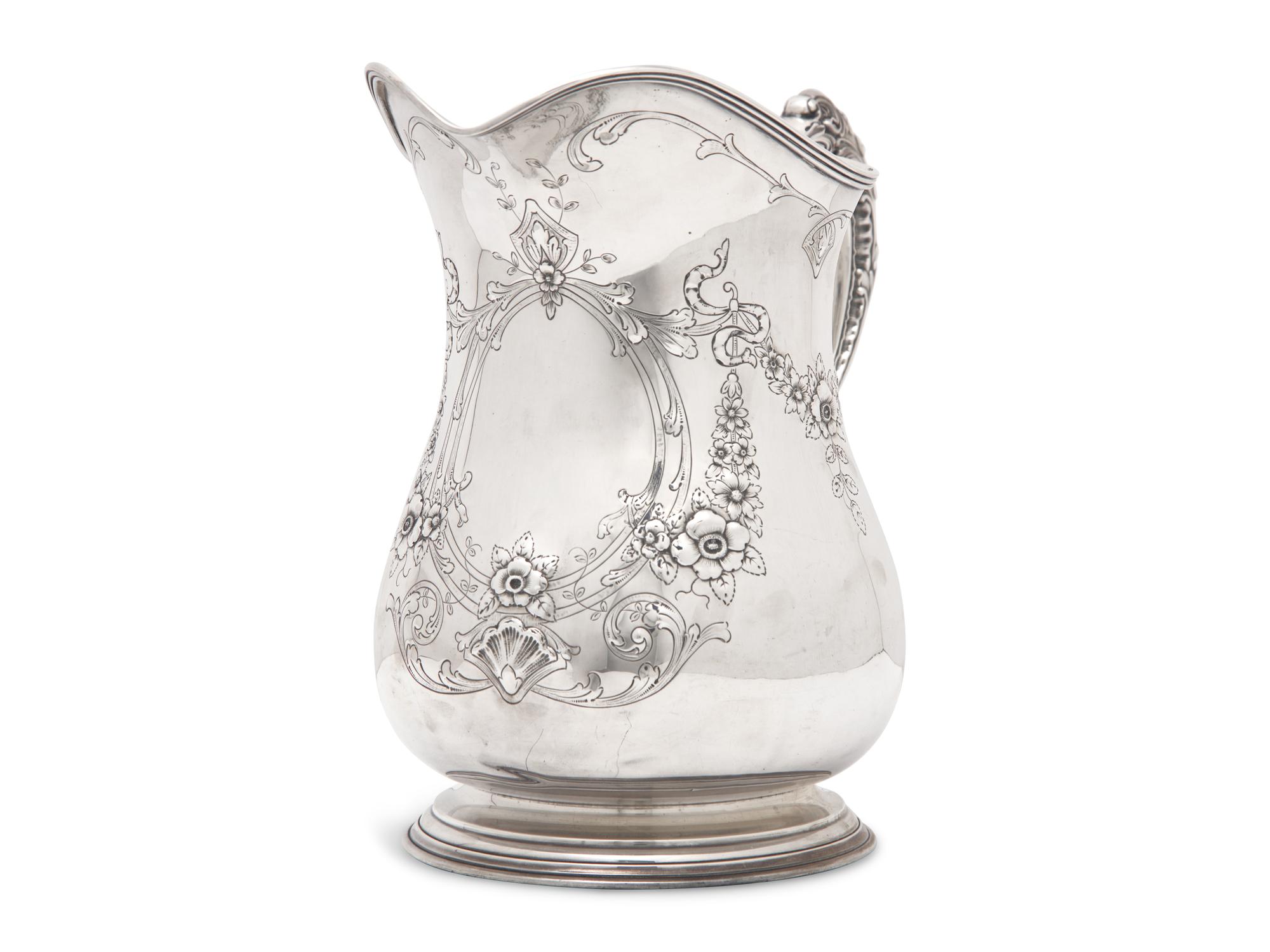 An American Sterling Silver Repousse Water Pitcher