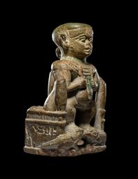 An Egyptian Glazed Steatite Amulet of Pataikos on Crocodiles