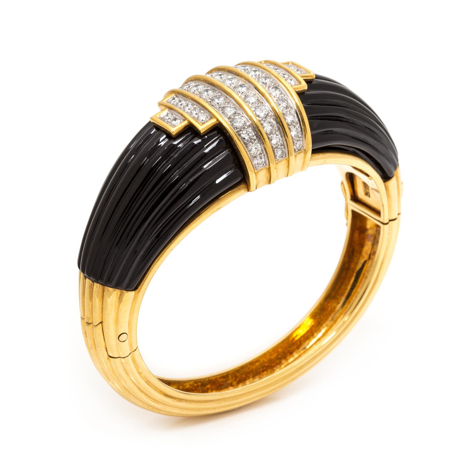 An 18 Karat Yellow Gold, Diamond and Onyx Bangle Bracelet, Montreaux, 69.45 dwts.