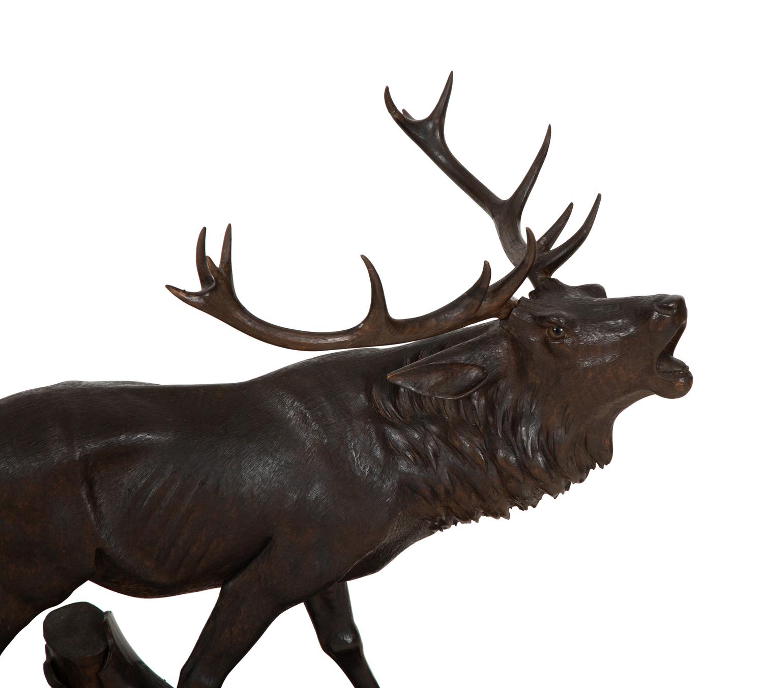 A Swiss Black Forest Carved Walnut Figure of an Elk