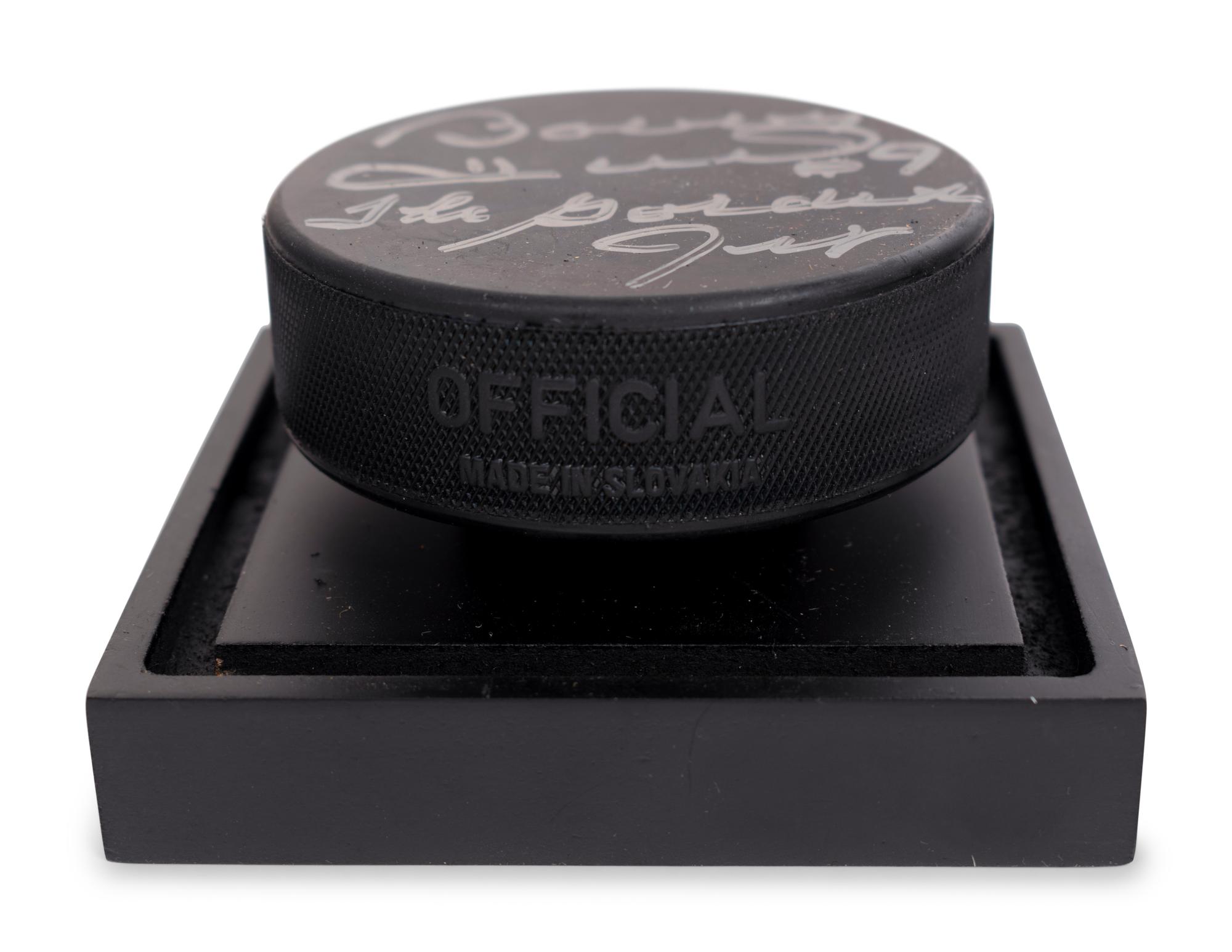 (Sports) A group of hockey memorabilia, comprising: