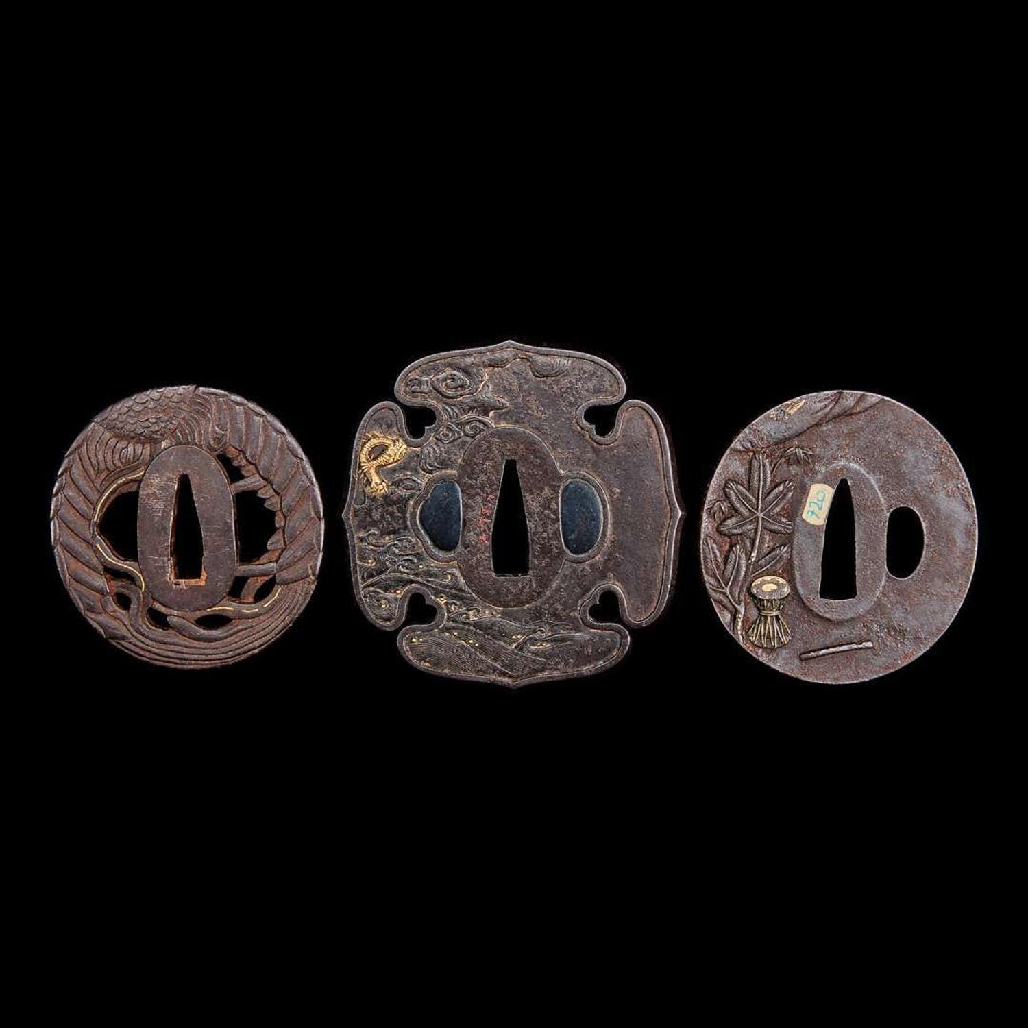 A group of three Japanese gold-inlaid iron tsuba, one signed 日本嵌金刀镡一组三件 一件带签字 Edo to early Meiji period ?????