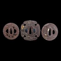 A group of three Japanese gold-inlaid iron tsuba, one signed 日本嵌金刀镡一组三件 一件带签字 Edo to early Meiji period ?????