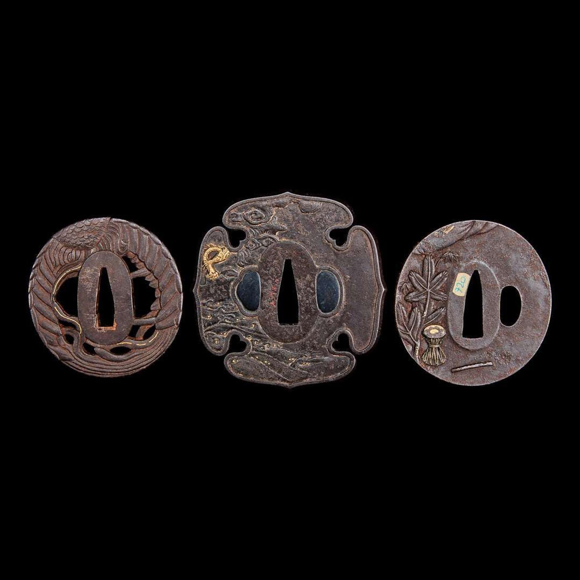 A group of three Japanese gold-inlaid iron tsuba, one signed 日本嵌金刀镡一组三件 一件带签字 Edo to early Meiji period ?????