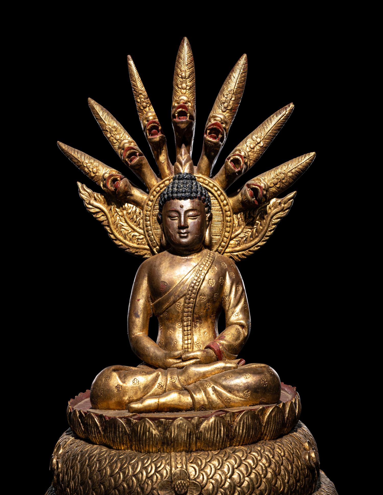 A Large Thait Gilt and Red Lacquered Wood Figure of Buddha