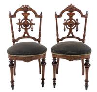 A Pair of Continental Walnut Side Chairs Height 36 1/2 inches. — 20TH CENTURY
