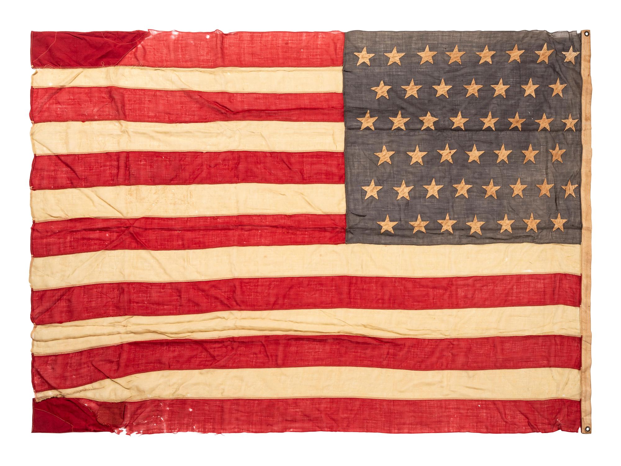 [SPANISH AMERICAN WAR]. 45-star Spanish American War-era flag identified to George W. Potter, Company K, 2nd Massachusetts Infantry, with related stereoviews, bookends, and other imprints.
