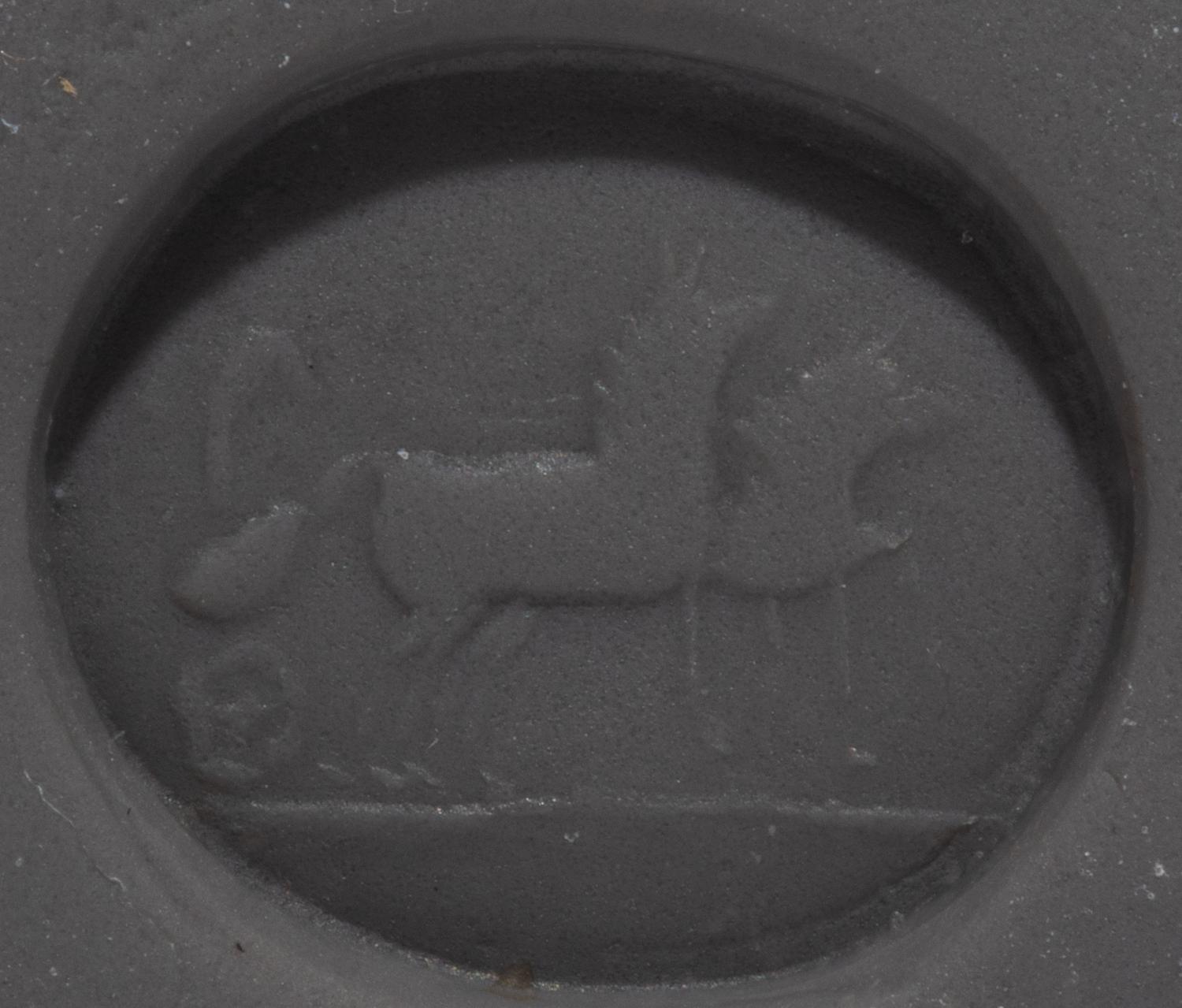 A Roman Carnelian Intaglio with Eros Driving a Biga