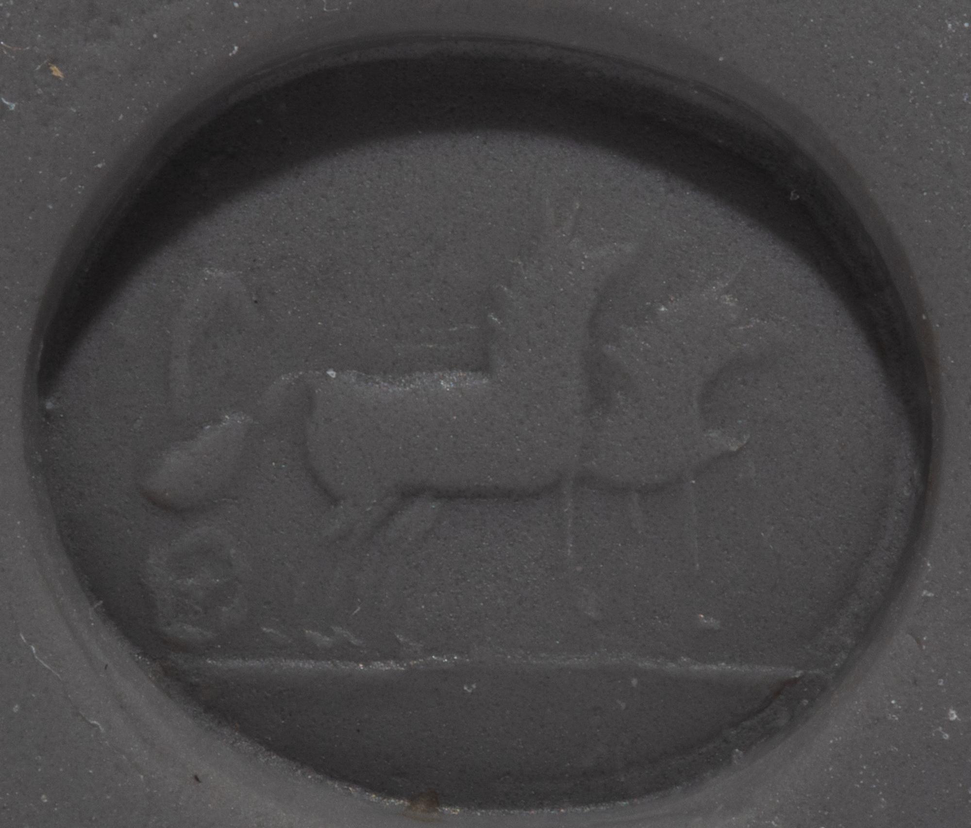 A Roman Carnelian Intaglio with Eros Driving a Biga