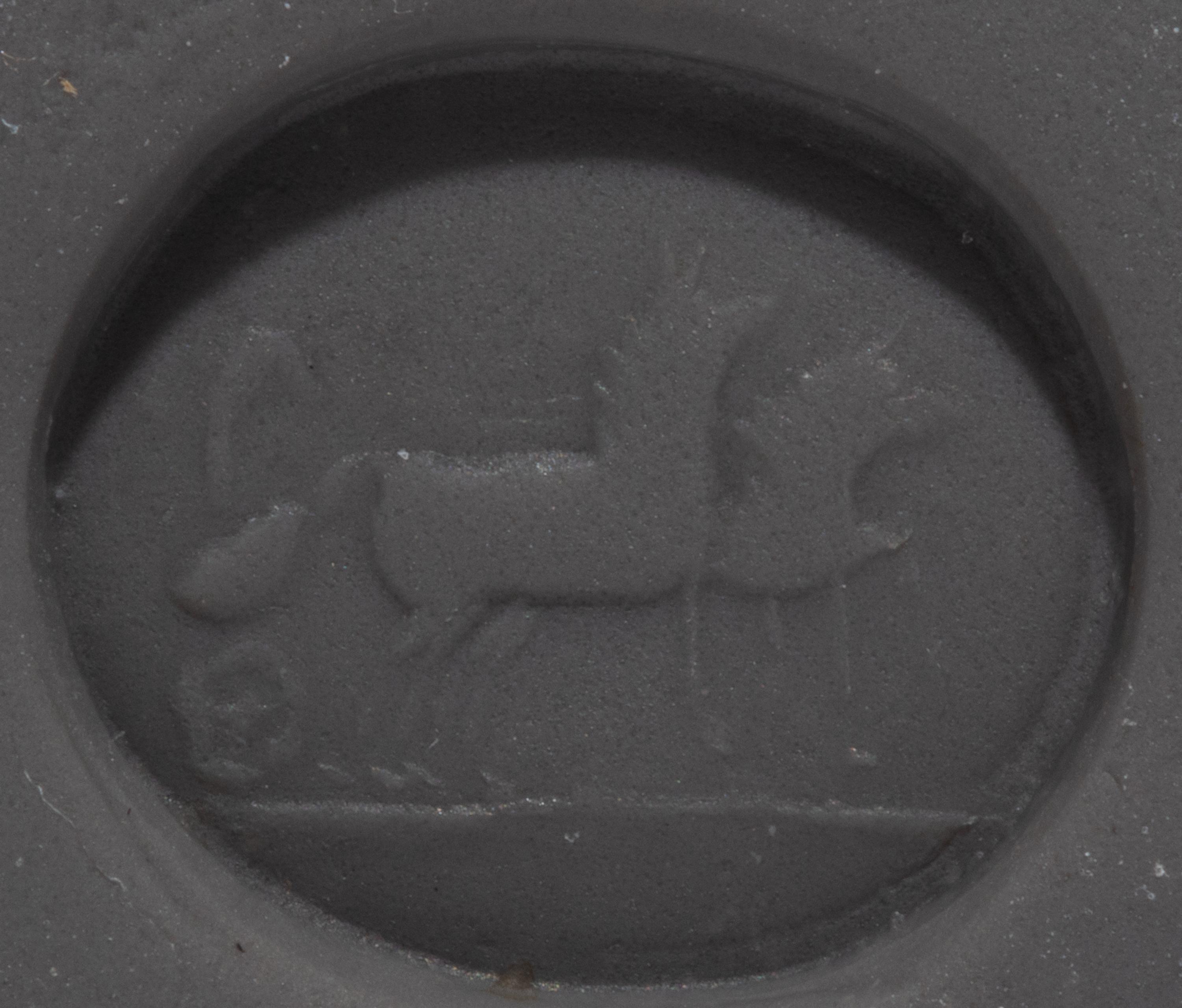 A Roman Carnelian Intaglio with Eros Driving a Biga